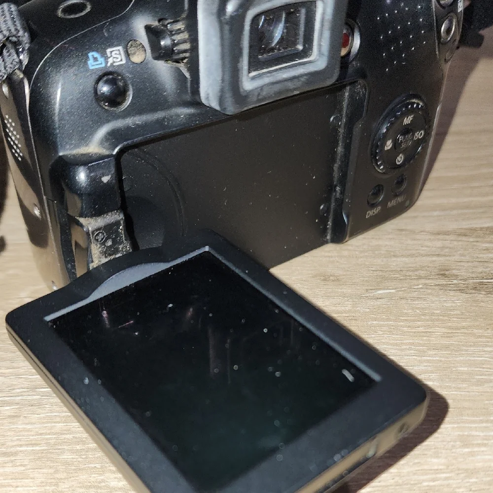 Canon Black Digital DSLR Camera with Ergonomic Grip and Optical Viewfinder